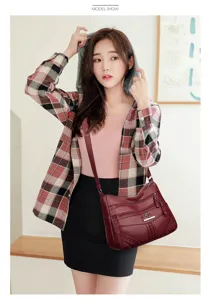 Detailed view of the burgundy multi-layer soft leather women shoulder bag for daily casual use.