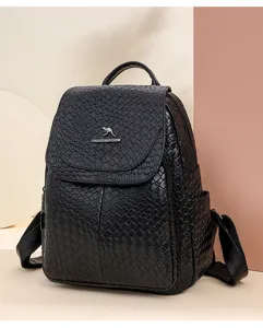 Black woven backpack detail, stylish casual daypack with flap closure and ample capacity.