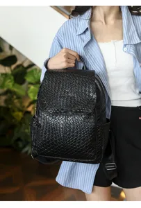 Black woven leather backpack for women, casual fashion travel school bag for daily use.