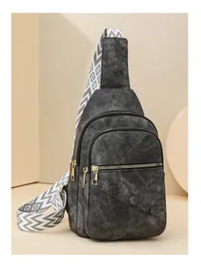 Stylish women's crossbody sling bag with wide geometric strap and double-layer pockets detail.