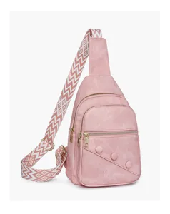 Detail view of the pink casual chest bag, featuring a stylish geometric strap and metal zippers.