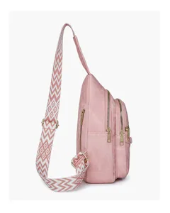 Detailed side view of a stylish pink chest sling bag with geometric pattern wide strap.