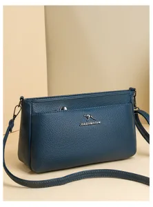 Blue soft leather cross-body bag for women, stylish casual shoulder handbag with metal accent.