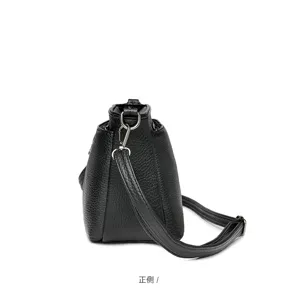 Side detail view of a classic black soft leather women shoulder crossbody bag design.