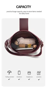 Wine red shoulder hobo bag interior capacity detail showing spacious storage for daily items.