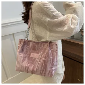 Stylish pink pleated tote bag for women, elegant shoulder bag with chain strap and handle.
