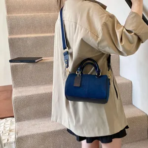 Casual two-tone denim boston bag with shoulder strap for women fashion daily use.