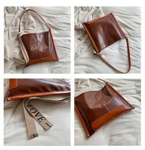 Grande borsa a tracolla elegante da donna, borsa tote alla moda con cinturino colorato.
