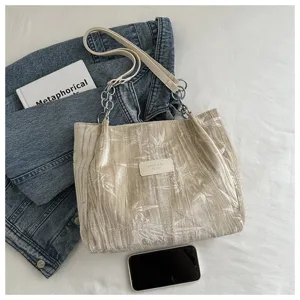 Stylish pleated beige tote bag with chain strap, large capacity casual shoulder bag for women.