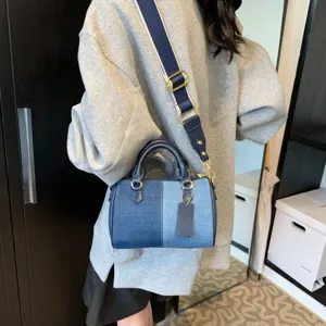 Stylish denim patchwork Boston handbag for women, casual crossbody shoulder pillow bag.