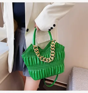 Green gathered handbag with chunky gold chain detail, stylish tote bag for women daily wear.