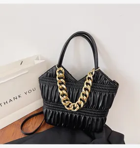 Black pleated shoulder bag for women with chunky gold chain, stylish casual crossbody purse.