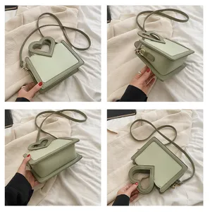 Schicke grüne Umhängetasche mit Herzgriff für Damen, modische PU-Leder-Handtasche.