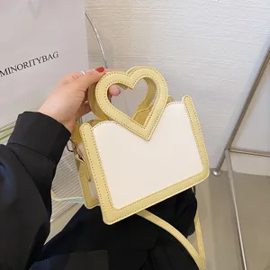 Herzgriff Umhängetasche stilvoll gelb weiß PU Leder Schulter Handtasche Detailansicht