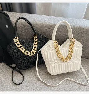 Stylish women handbag with gold chain decor, top handle and crossbody strap for daily casual wear.
