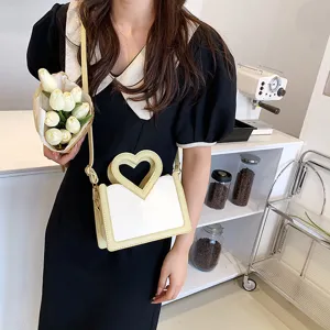 Schicke gelb-weiße Damen Umhängetasche mit Herzform Griff für stilvolle Alltagsoutfits.