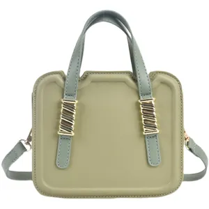 Green handbag for women, unique biscuit shape design, stylish top handle and crossbody bag.