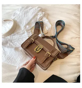 Vintage schoudertas voor dames met slot, stijlvolle bruine PU lederen handtas voor werk.
