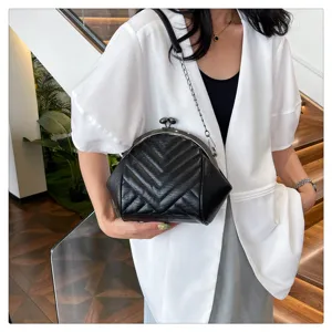 Women's black quilted shell bag with chain strap, retro kiss lock shoulder crossbody bag.