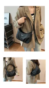 Black pleated underarm shoulder bag detail showing vertical texture and adjustable strap.