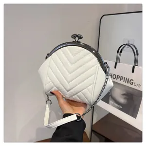 White quilted chevron kiss-lock shoulder bag with metal chain strap for women chic daily use detail