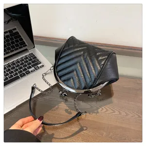 Black quilted shell shoulder bag with chain strap, stylish PU leather crossbody bag for women.