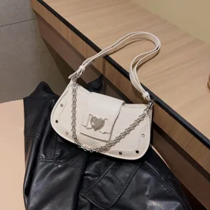 Chic white croc pattern underarm bag with metal heart buckle and chain strap for women.