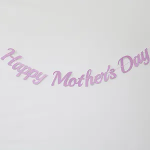 Pink glitter Happy Mother's Day banner hanging decoration detail shot for holiday party setup.