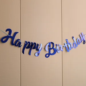 Blue happy birthday banner hanging on the wall, perfect party decoration detail shot.