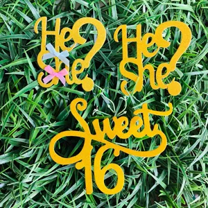 Gold glitter paper cake toppers featuring He She and Sweet 16 designs, ideal for party decor.