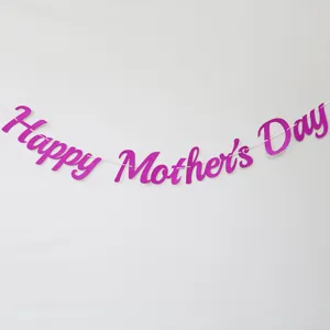 Close up detail shot of pink glitter Happy Mother's Day letter banner for party decor.