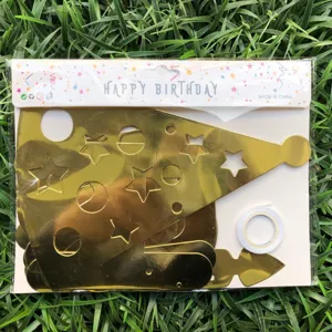 Gold birthday party hat DIY material pack closeup with star and circle cutouts detail