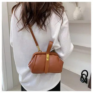 Bruine schoudertas van gestructureerd leer, stijlvolle vintage handtas met kliksluiting.