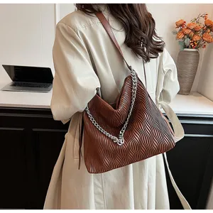 Stylish brown pleated shoulder bag for women, large capacity vintage hobo tote for daily commute.