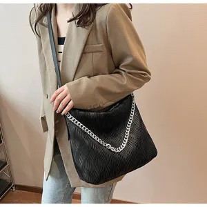Black slouchy shoulder bag for women, large capacity casual tote with silver chain.