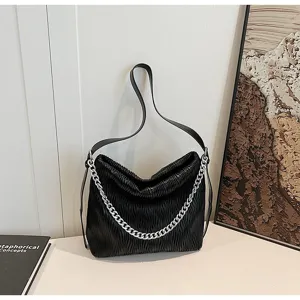 Fashionable black pleated shoulder bag for women with silver chain, stylish and roomy daily purse.
