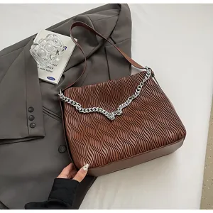 Brown pleated shoulder bag with silver chain strap, vintage commuter tote for women.