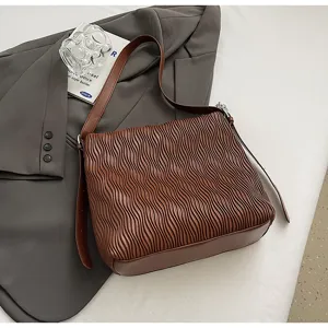 Brown pleated shoulder tote bag detail showcasing retro design, large capacity and texture.