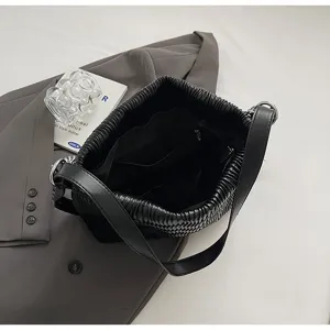 Black pleated shoulder bag for women, stylish large capacity tote purse for daily commuting.