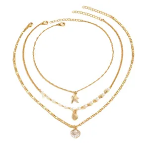 Elegant multi-layer gold necklace with starfish, conch, and pearl shell pendants