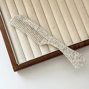 Acetate hair comb with handle, French marble texture, anti-static round teeth for daily styling.
