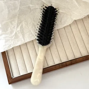 Boar bristle hair brush with elegant acetate handle for styling and daily scalp massage.
