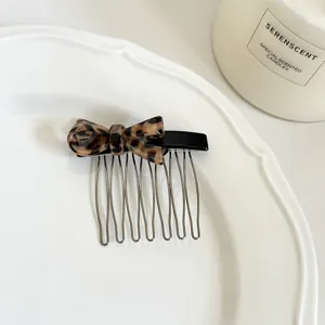 Korean style leopard print bow acetate hair comb detail view for women's elegant daily styling.