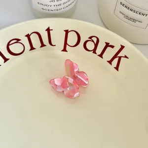 Pink acetate butterfly hair claw clip for sweet daily styling and side fringe decoration.