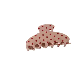 Grosse rosa Haarklammer mit roten Punkten, stilvolles Haaraccessoire fuer Damen.