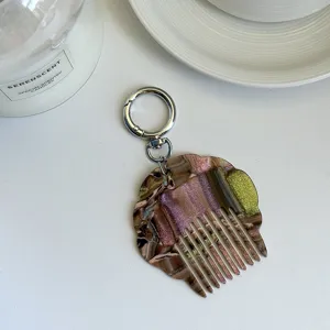 Portable mini acetate seashell comb keychain, pearl marble bag charm for daily use and styling.