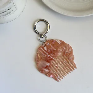 Portable mini acetate shell comb keychain pearly marble pattern bag pendant detail view