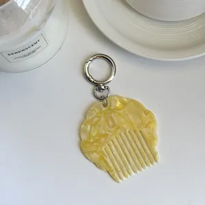 Portable mini acetate shell comb keychain, stylish pearlescent marble design bag pendant.