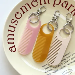 Leuke mini kam sleutelhanger draagbare schattige tashanger stijlvol effen haaraccessoire