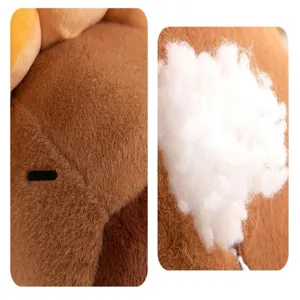 Plush toy fabric and filling detail close-up view showing soft texture and fluffy cotton material.